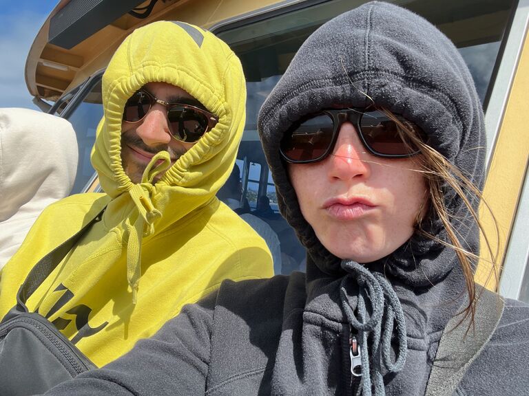 Covering up from an extremely windy Australian boat ride