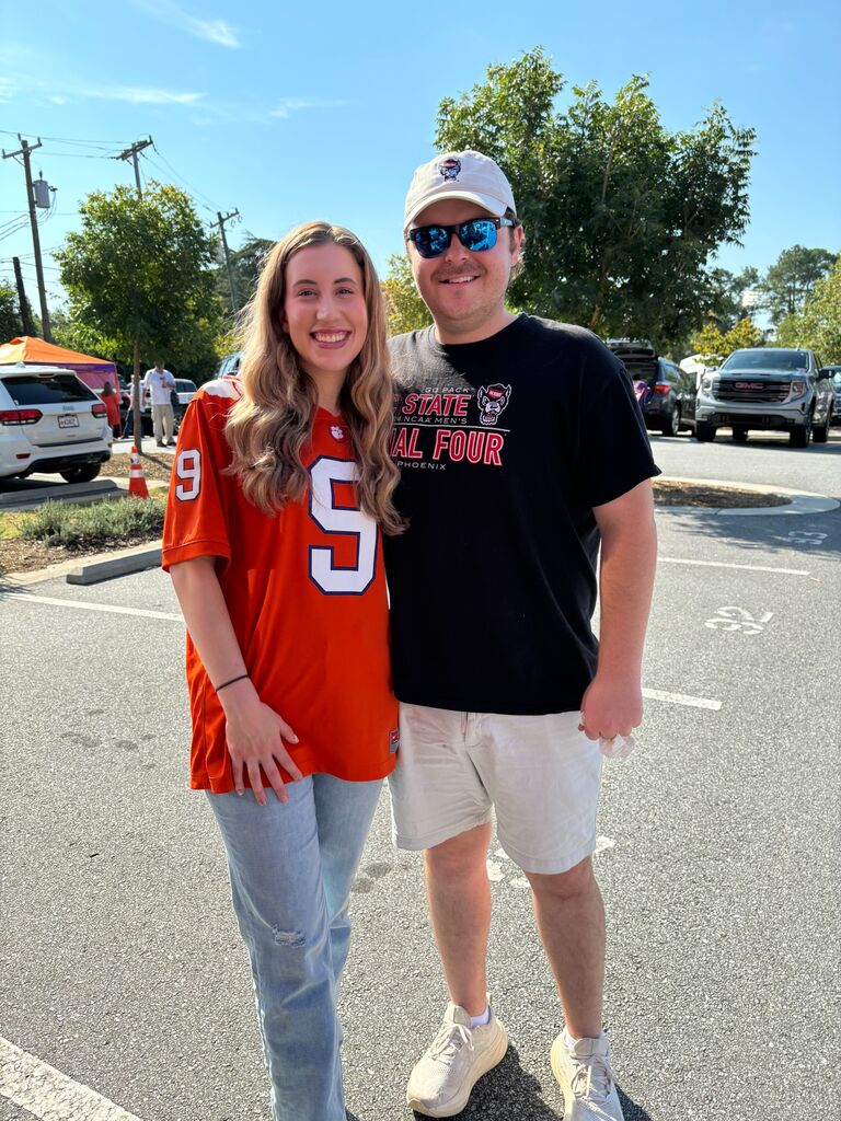 Julia took James to a Clemson game. He may have been the only fan not wearing orange.