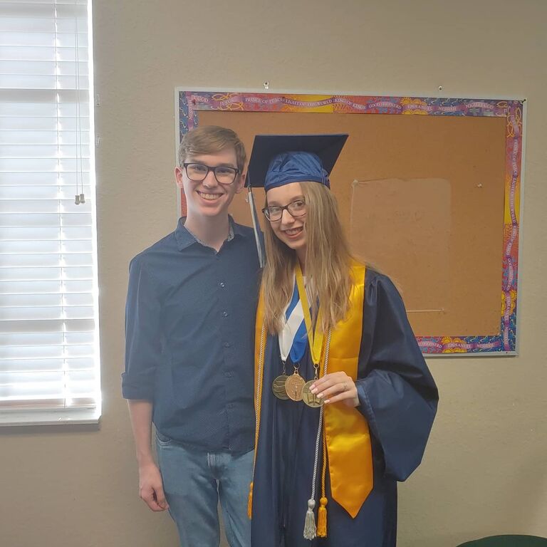 Sophia graduated high school in the class of 2021, and Lucas was there to support her