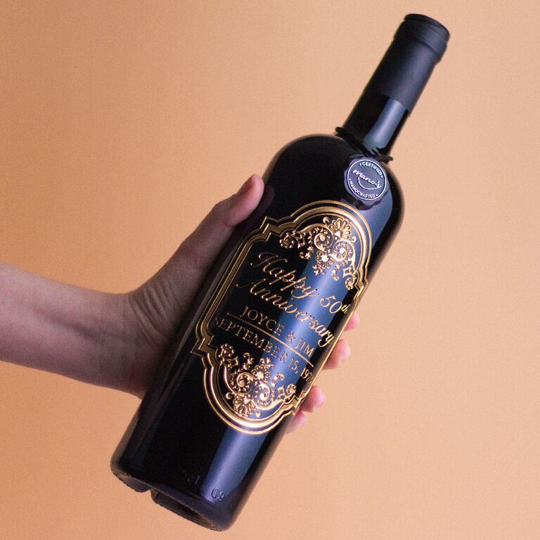 Black wine bottle with gold engraving for 50th anniversary