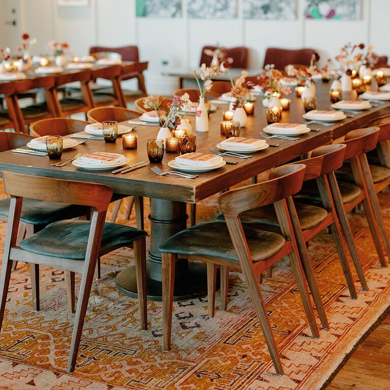 Wedding reception tables with floral and candle decor