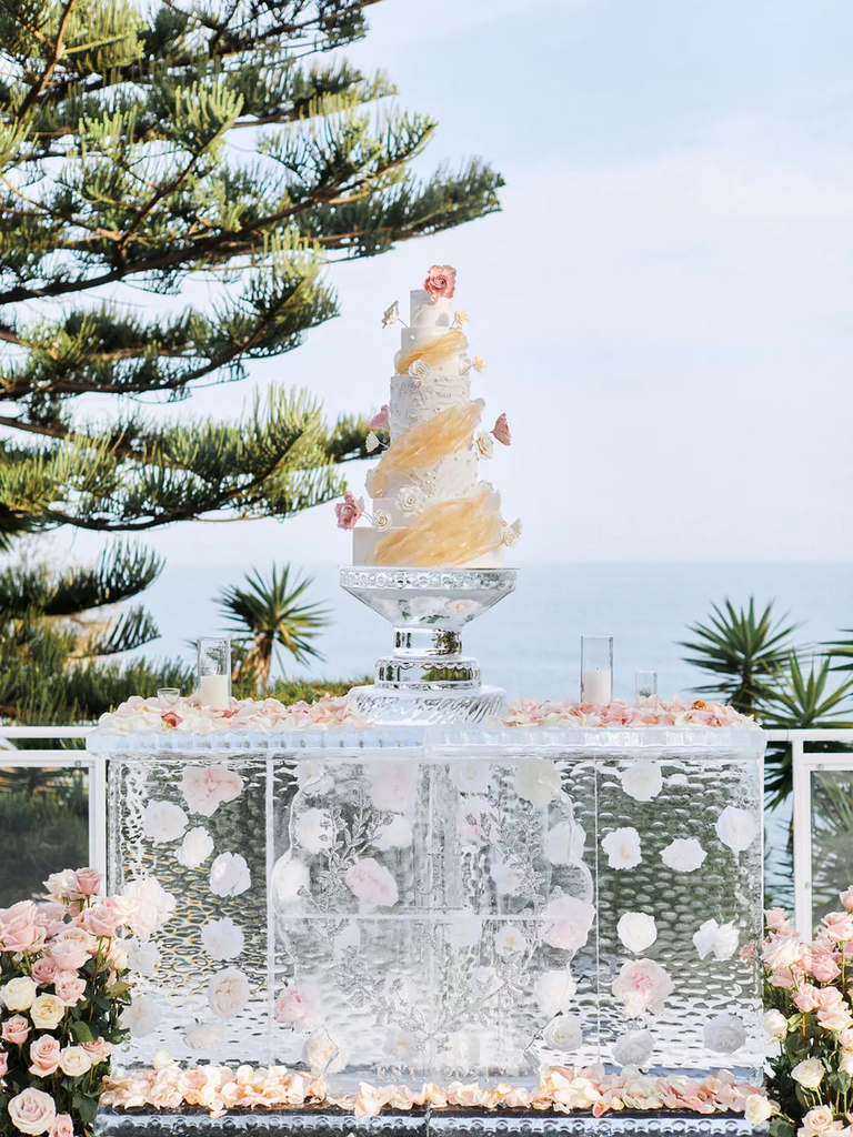 A wedding cake and ice sculpture display