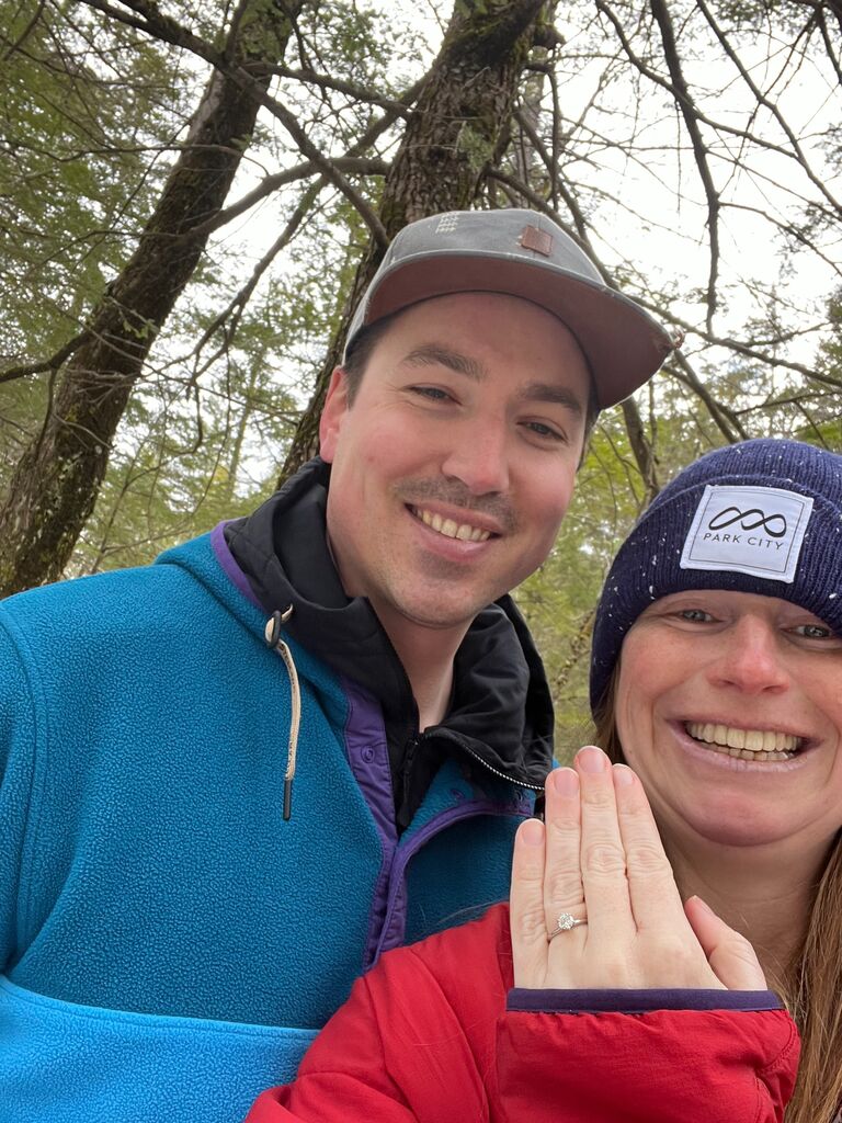 Mike proposed to me while on a hike as we were crossing a bridge by a waterfall!