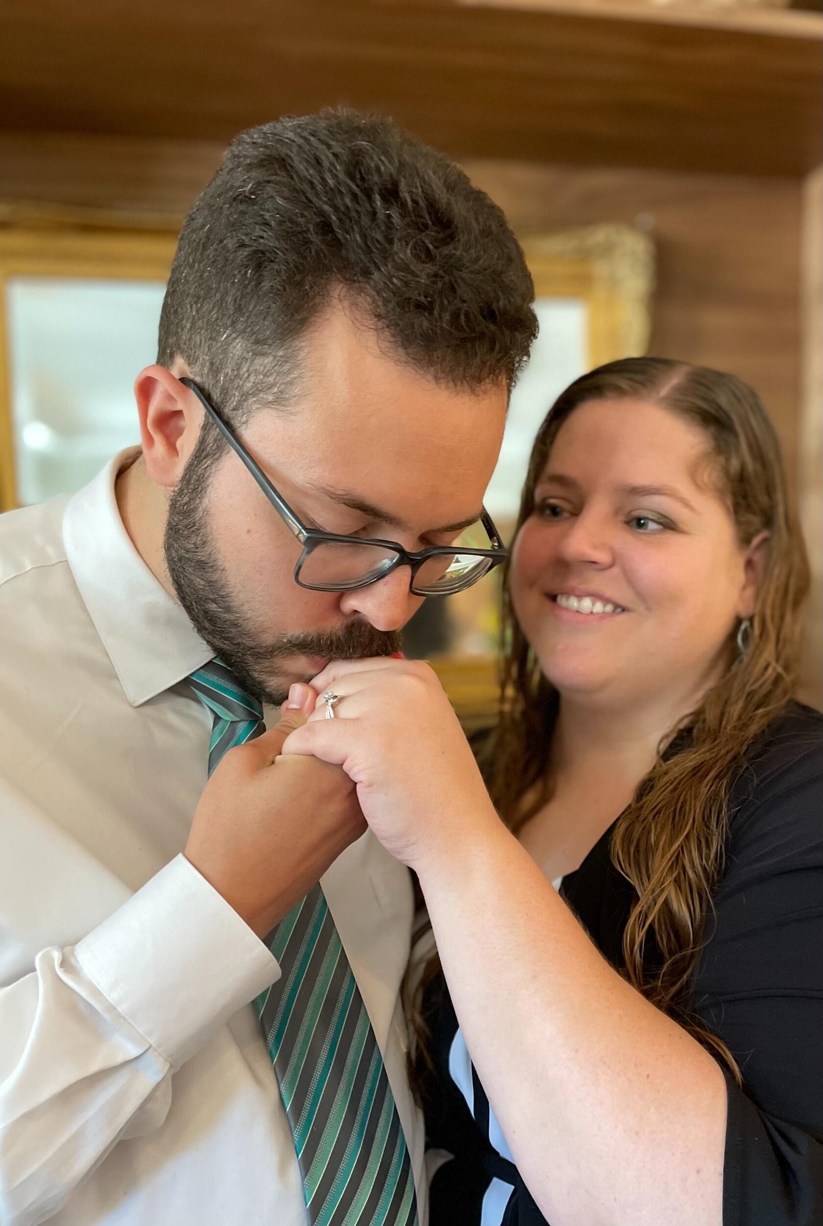 The Proposal HER STORY - So I thought I was going to brunch with my mom and a family friend but my mom was being very suspicious, saying things like “Yeah, I think this is a nice restaurant, like the family friend said we needed a reservation. So, we should dress up.” Naturally I was like “Uugghhh really…” and then when my mom said I could even wear one of my dresses I was definitely suspicious, she never suggests things like that!

So, I got ready and then as we were driving, I was again suspicious that the gps said we were going to Cary, they never choose restaurants in Cary when we go out. Then when the directions got more specific, I was like “Hmm I think we are going to the Mayton restaurant.” I knew James and I had previously had a special moment there and even considered it for a wedding venue. In my head I was calculating what exactly the odds were that our family friend would have chosen that restaurant (I almost teared up at this point in the car) but I was willing to give it reasonable doubt because James was supposed to be at work all day. 

We park and go in the front doors of The Mayton and Ashley Gagnon is standing there with a sign in her hand and that’s when I knew this was the proposal and the tears started! I walked up and hugged her and she gave me the sign that had a sweet message from James and photos from our first date on it.

And then 10ft behind her was Julia Yao with another sign with more photos and another message. I hugged her and she also gave me the sign from James.

Then Meredith Rollins was down the hall from her with a third sign, she was by a glass door leading to a little secluded patio where James was waiting for me.

So I walked out on the patio and everybody followed me outside. James took both of my hands and said some really sweet things that in all honestly were a blur for several days afterward because I was so emotional. He had said how much he enjoyed our relationship and felt that it was a privilege to have gotten to know me over the last 11 months and that he would love to spend the rest of his life with me. Then he got down on one knee (yes, I’m still crying through this entire process) and he asked me to marry him!!

I let out another burst of tears and was just able to get out my "yes!!" 

He put the ring on my finger and stood up and kissed me! 

Then everyone came up to hug and congratulate us and we took some more photos before going inside for a really nice brunch at the restaurant. 