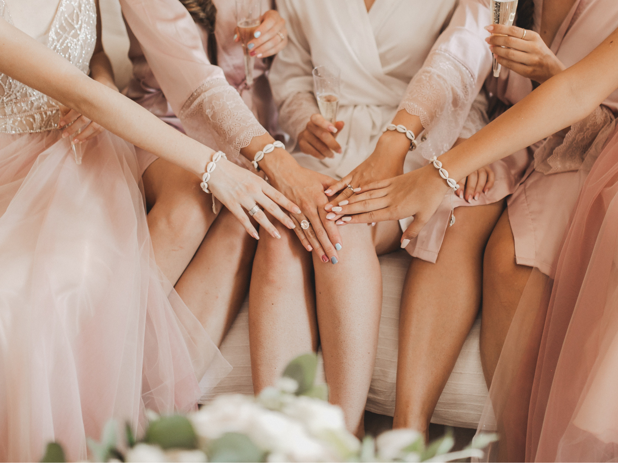 Bride and her bridesmaids with matching bracelets