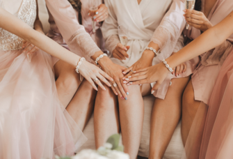 Bride and her bridesmaids with matching bracelets