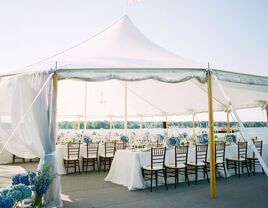 Outdoor wedding reception under a round open-air tent