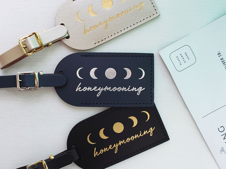 Black, blue and white leather tags with 'honeymooning' in gold or silver script and moon phase graphics