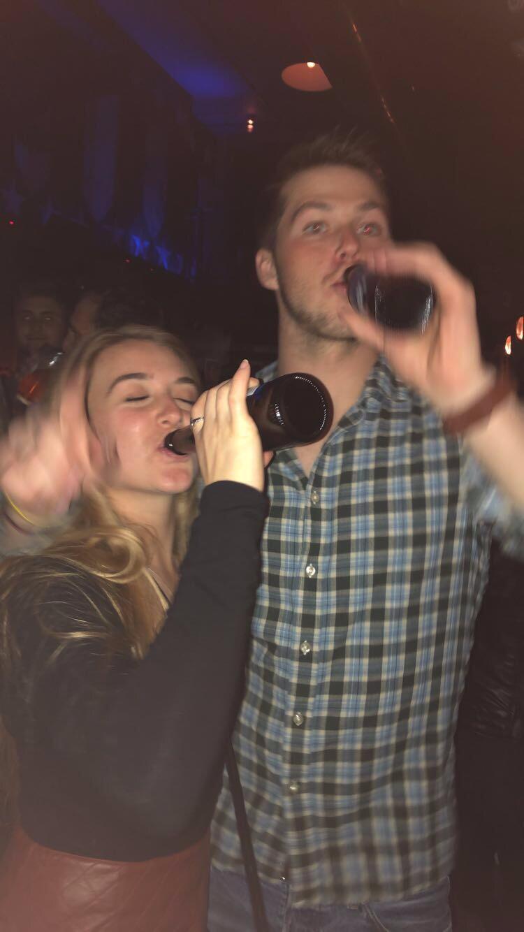 Started off our relationship as great friends through College attending Montclair State University. We both were fall sport athletes and business majors- we spent a lot of time together in the athletic centers, college classes, and yes, the bars. 
This was our first picture together out in Hoboken attempting to mask the heartbreak of ending both our college athletic careers.
