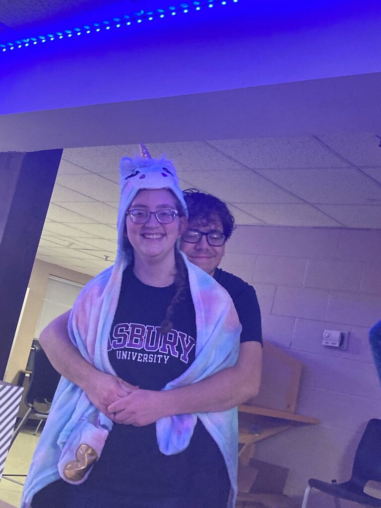 Emma and Shawn celebrating Shawn's 21st birthday... with a unicorn blanket?