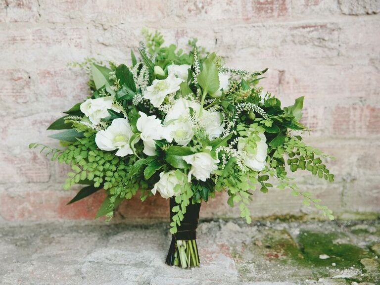 classic spring wedding bouquet with white flowers and greenery