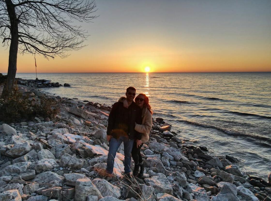 Shannon and Derek met on March 7th during the pandemic, and it was love at first sight! They spent the whole weekend together. The first rose Derek got Shannon was on March 9th, which is International Women’s Day. This photo was taken just a week after we met. Shannon took Derek to her parents’ Lakehouse. 