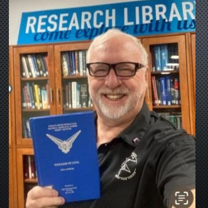 Steve conducts research at the library before giving a presentation. 