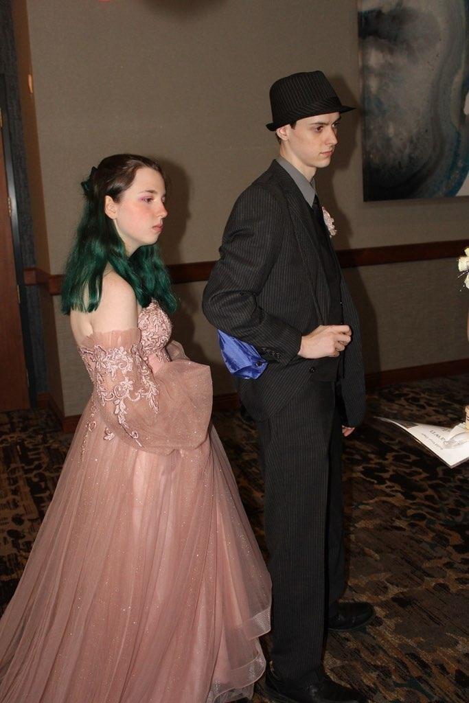 Senior Prom, one of two. Held in a huge convention center, the Homeschool Prom was splendid when it came to the photos, but it was NOT friendly to those with social anxiety.. (aka, both of us.)