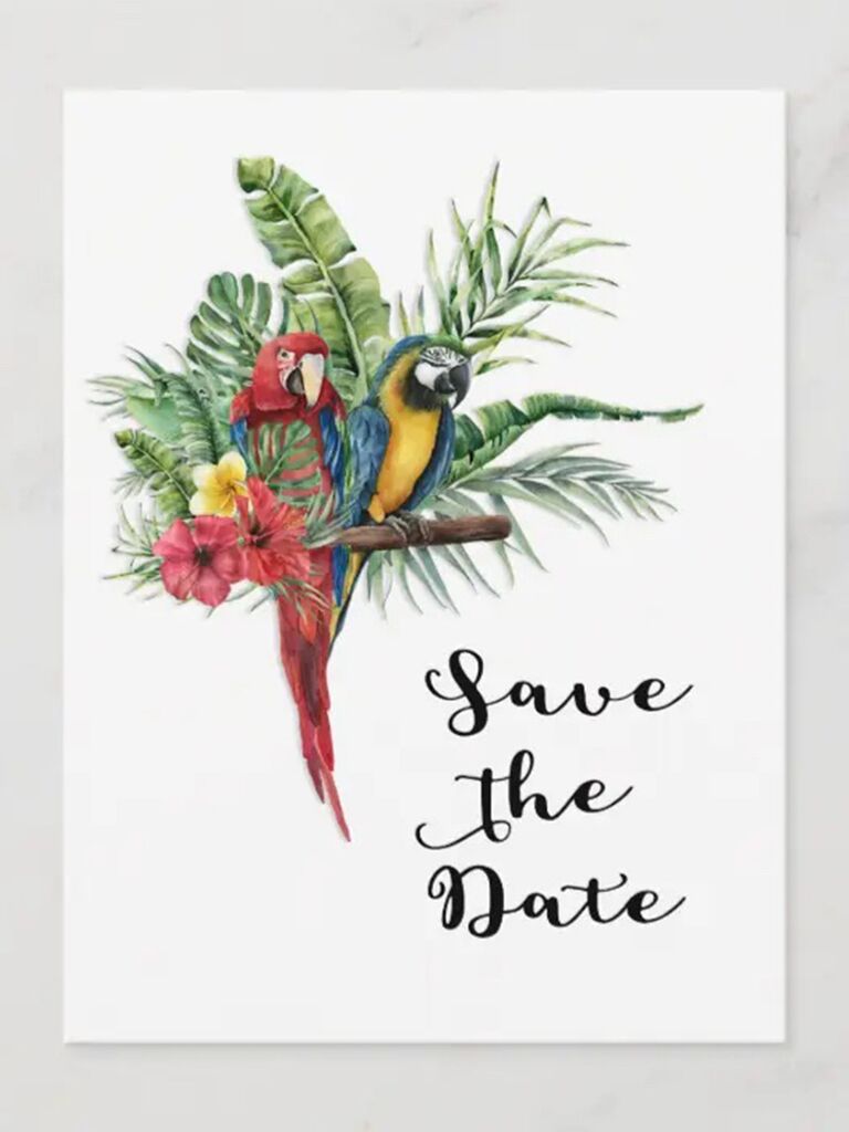 Parrots and tropical greenery with 'Save the Date' in loopy black script