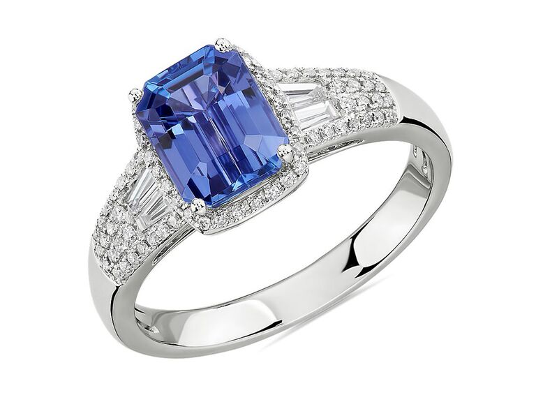 blue nile emerald cut tanzanite engagement ring with round diamond halo and round and rectangular diamond sides