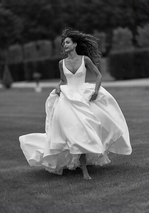 Graceful gown with modest straps and a plunging neckline. The basque waistline creates an outstanding silhouette and the layered puffy skirt balances the fitted bodice.