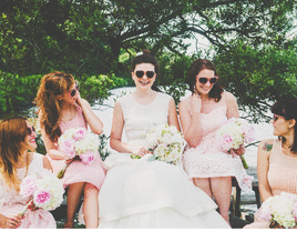 bridal party with pink dresses and sunglasses