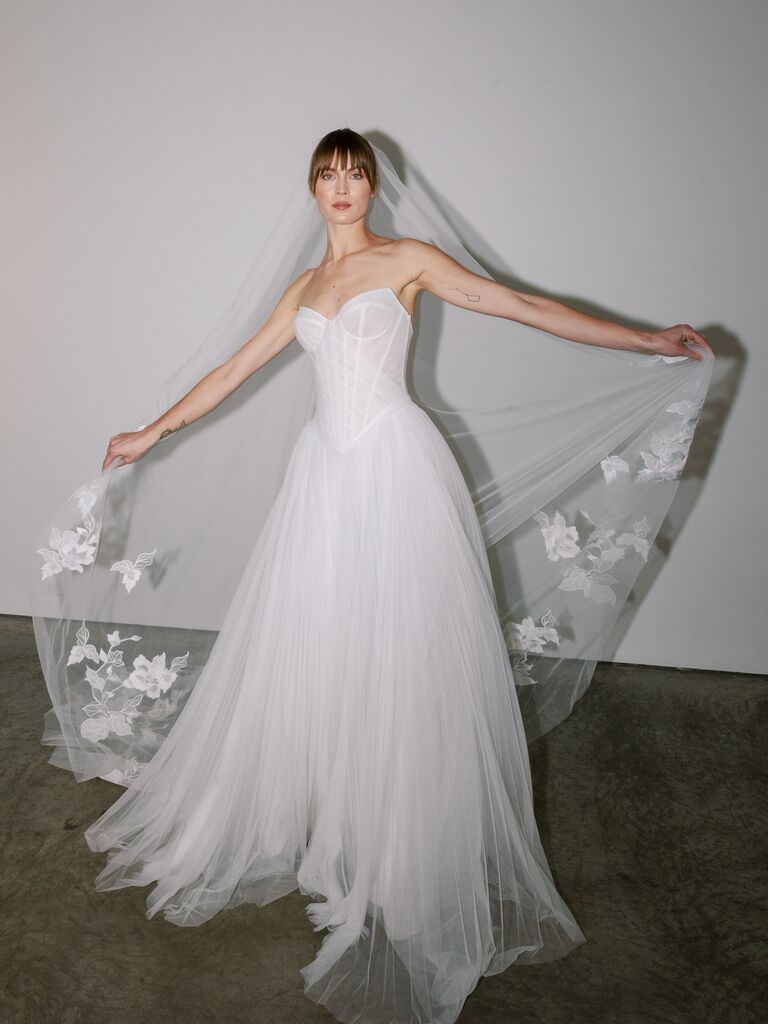 Pnina Tornai airy tulle wedding dress with strapless neckline and exposed boning