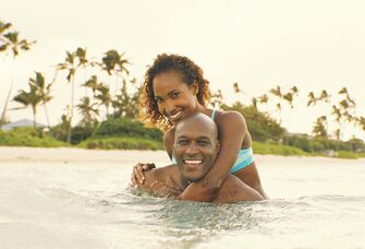 Couple swimming in Hawaii