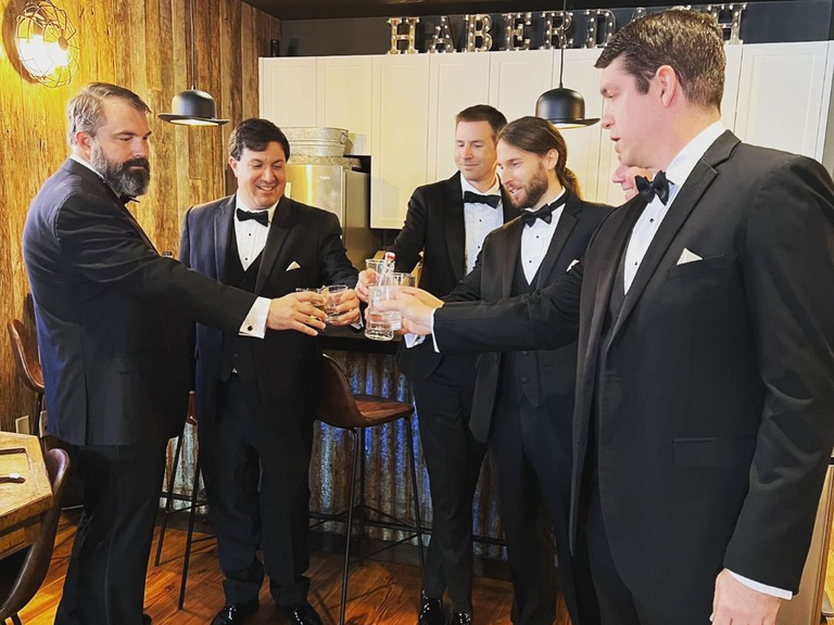 Gentlemen raise a toast at Haberdash Event Venue.