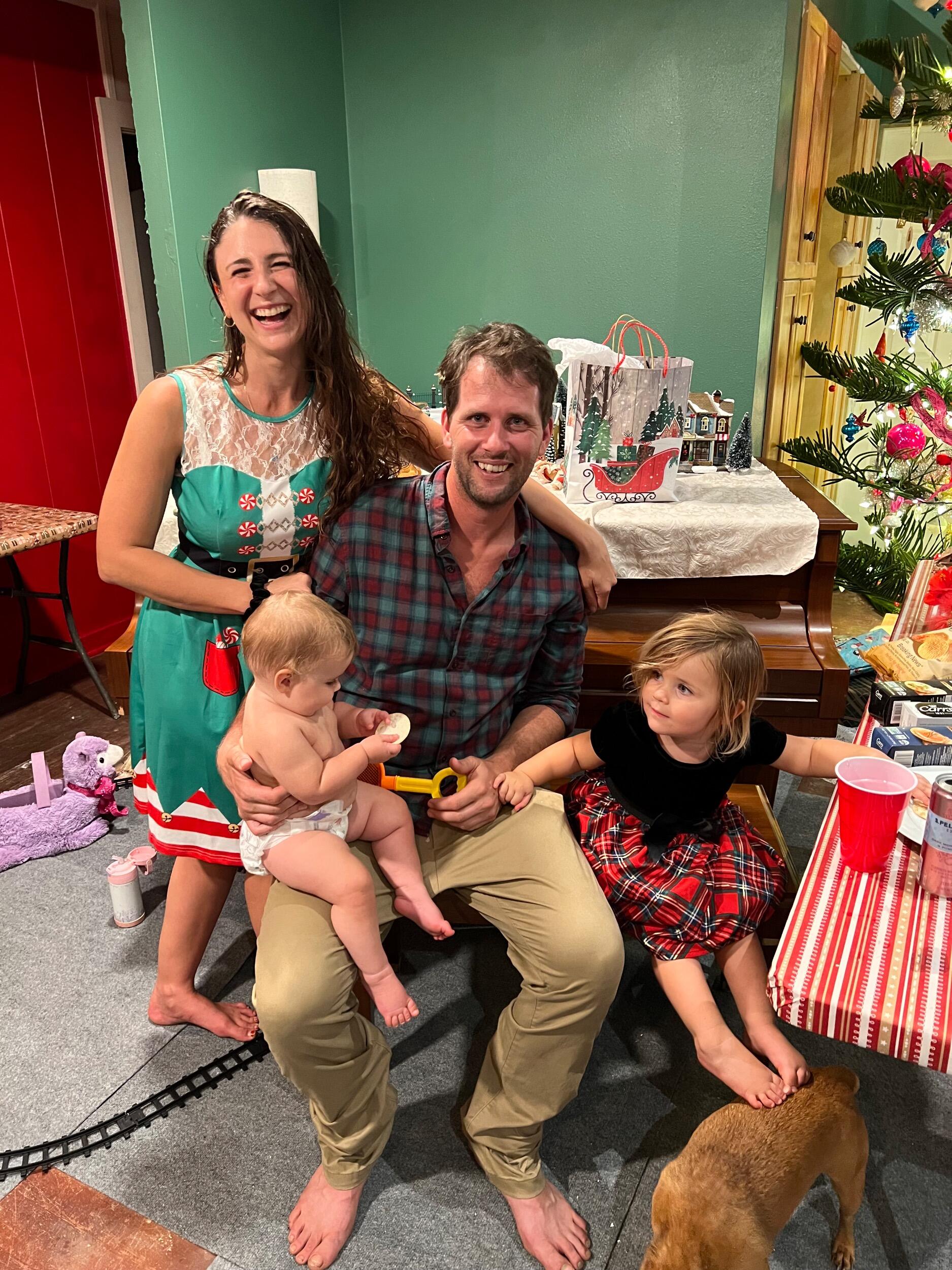 Chris pops the question during the white elephant gift exchange at their 3rd annual Christmas party 