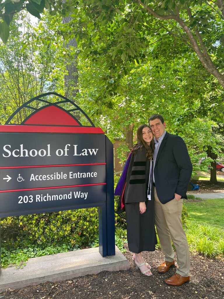 Nicole graduates law school. She could not have made it through without Austin's support! ⚖️