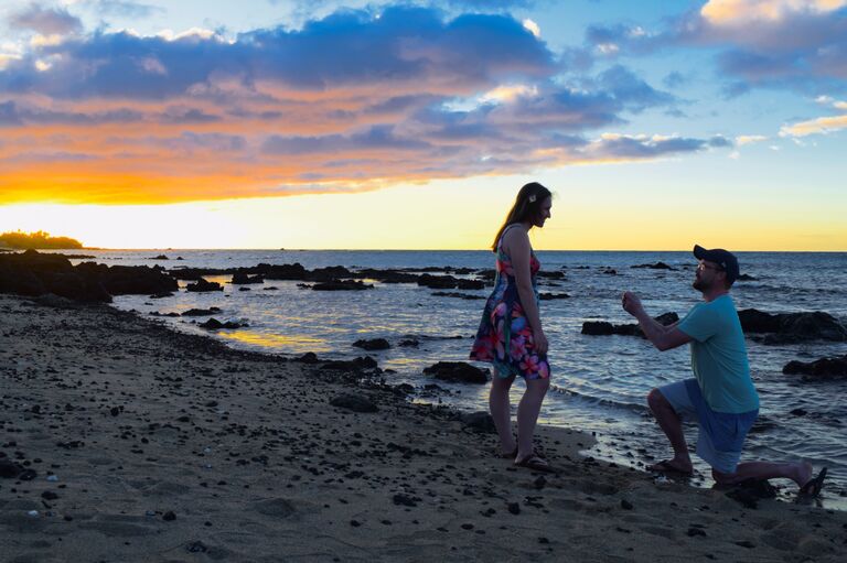 She said yes! Adam picked the perfect place to propose on the beach in Hawaii with a beautiful sunset