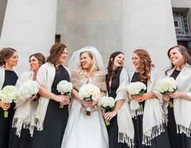 group of bridesmaids wearing white wraps