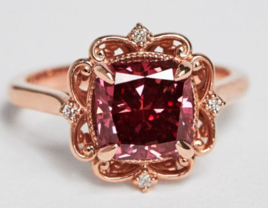 Cushion cut red diamond center with ornate rose gold halo