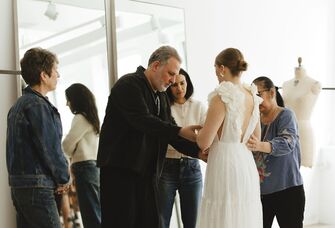 Bride at custom dress fitting