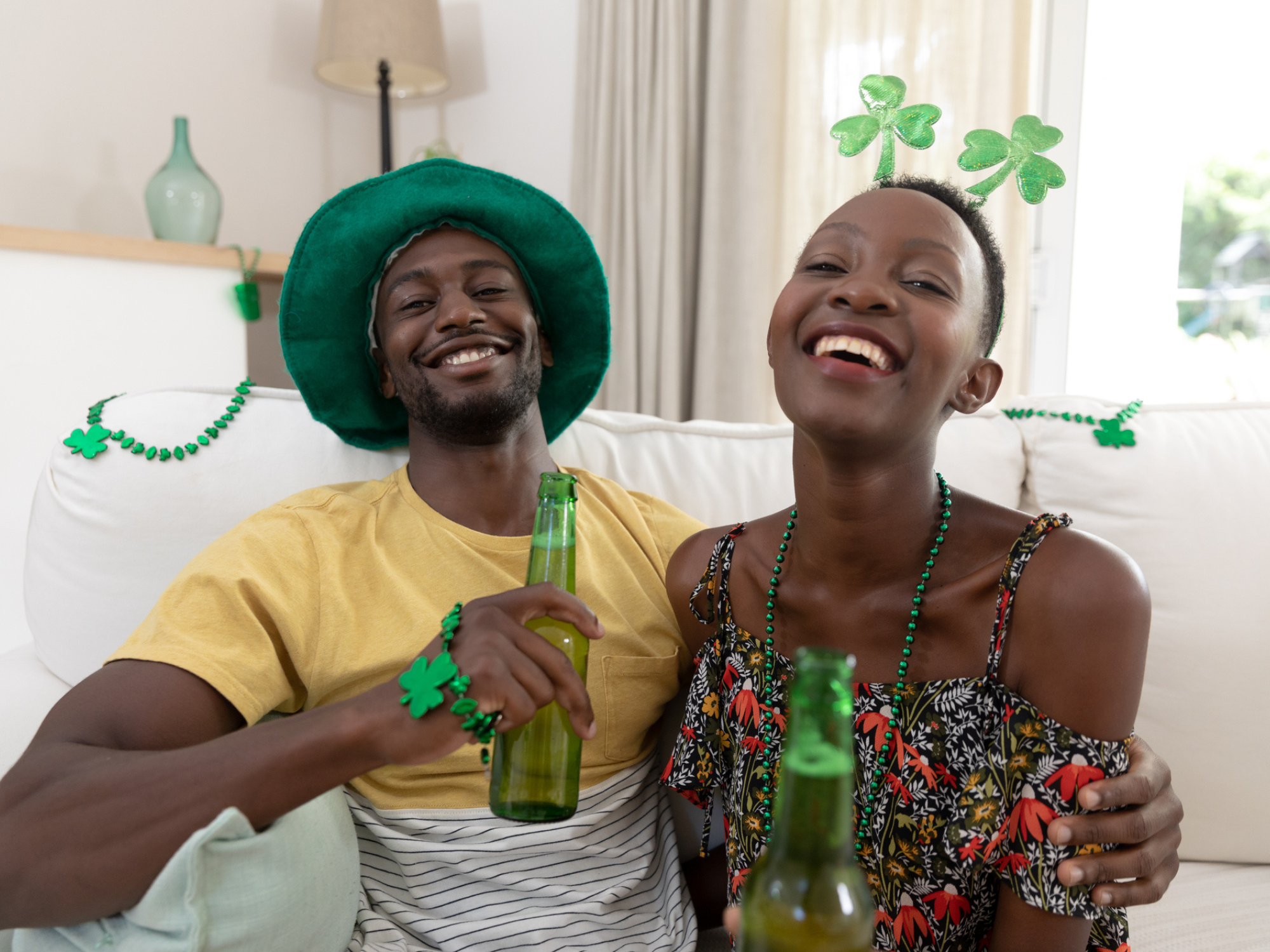 Couple drinking beer and wearing St. Patrick's Day attire