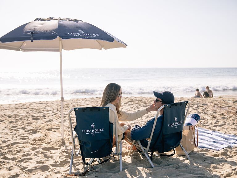 Couple having picnic on beach