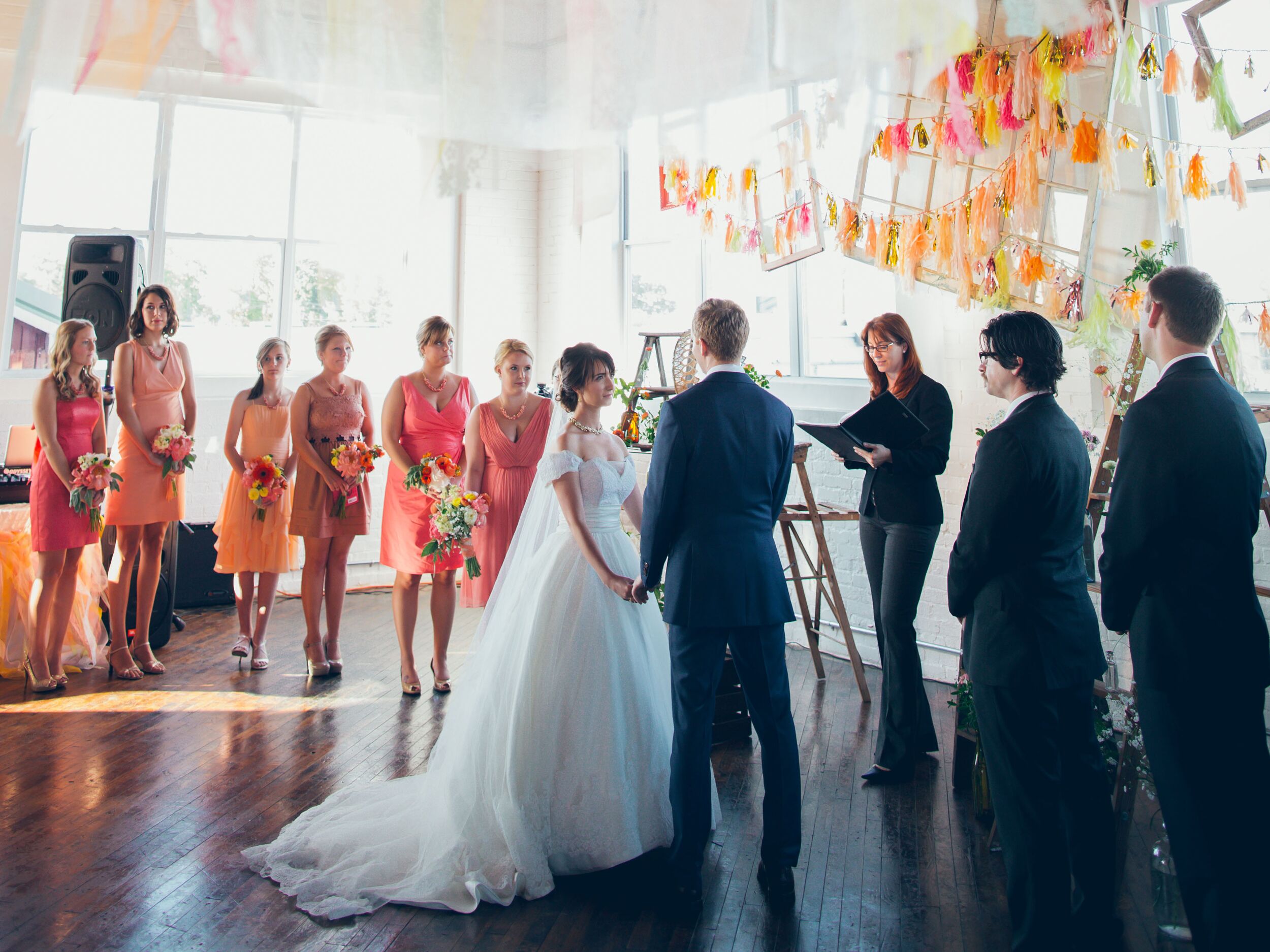 Vow exchange ceremony at bright DIY wedding