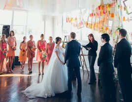 Vow exchange ceremony at bright DIY wedding