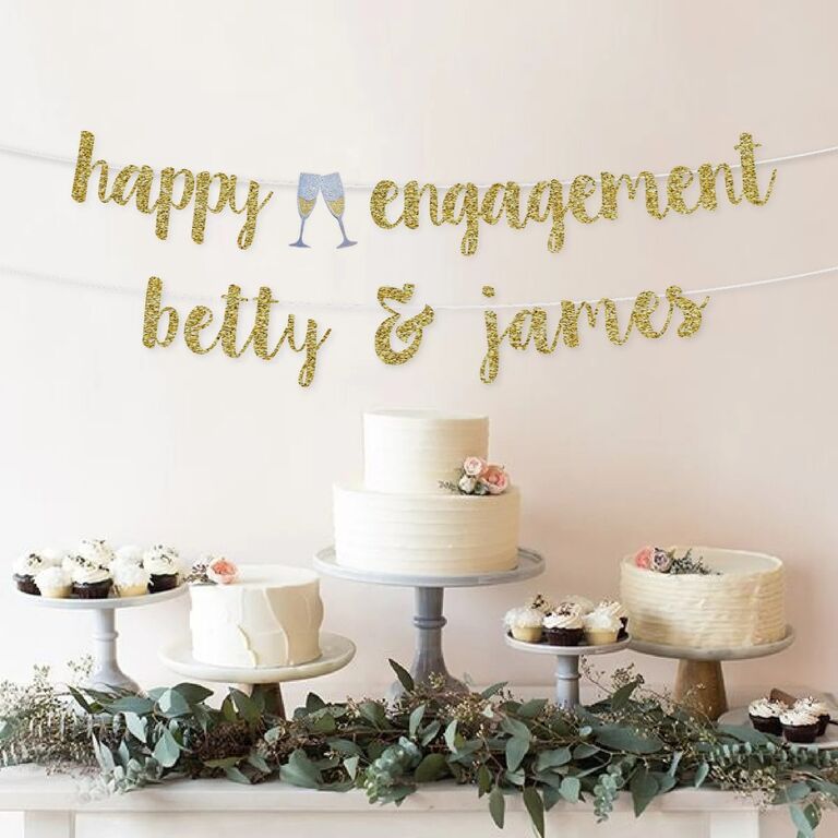 Personalized engagement banner with couple's names