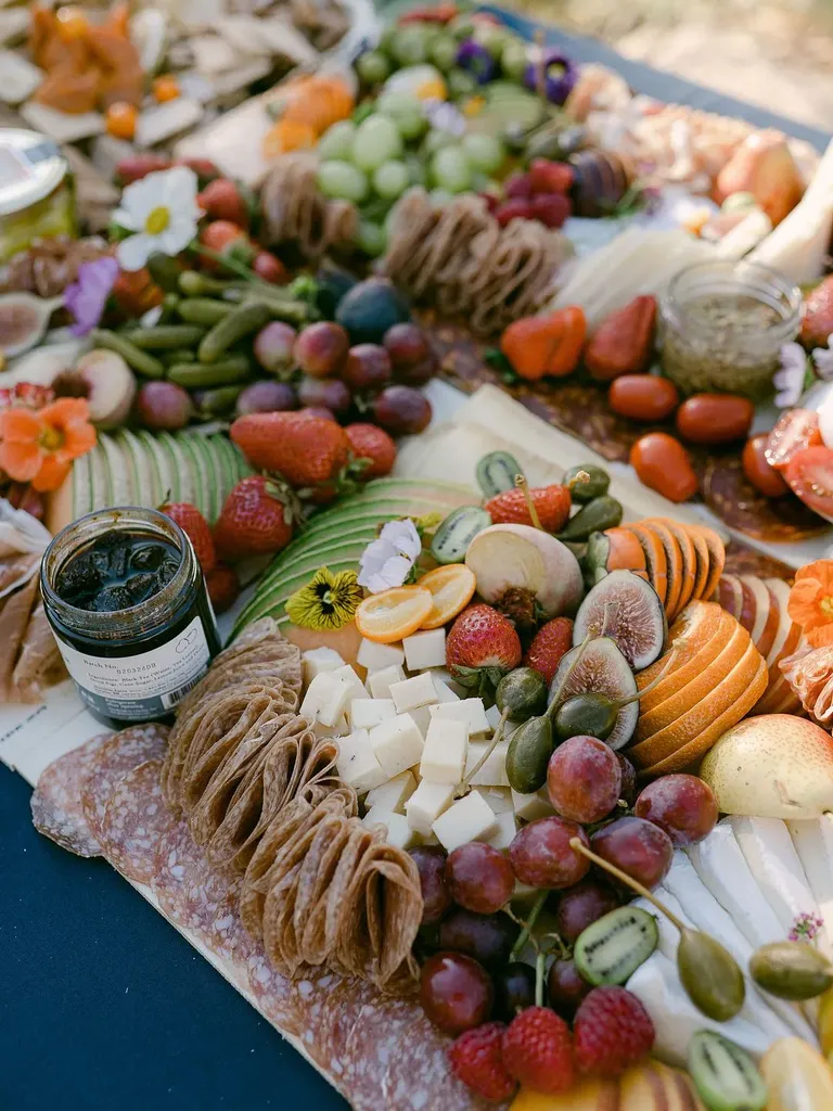 Traditional Charcuterie Board With Fruit and Flowers