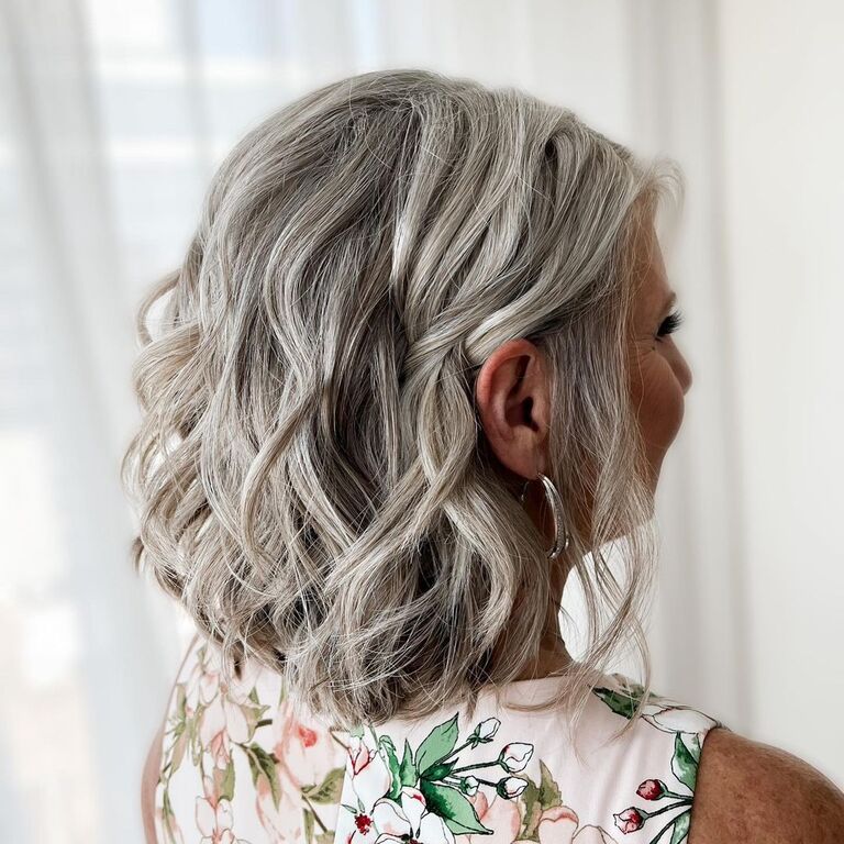 Medium-length curled wedding guest hairstyle