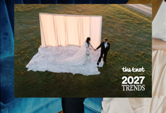bride and groom in front of luxe backdrop