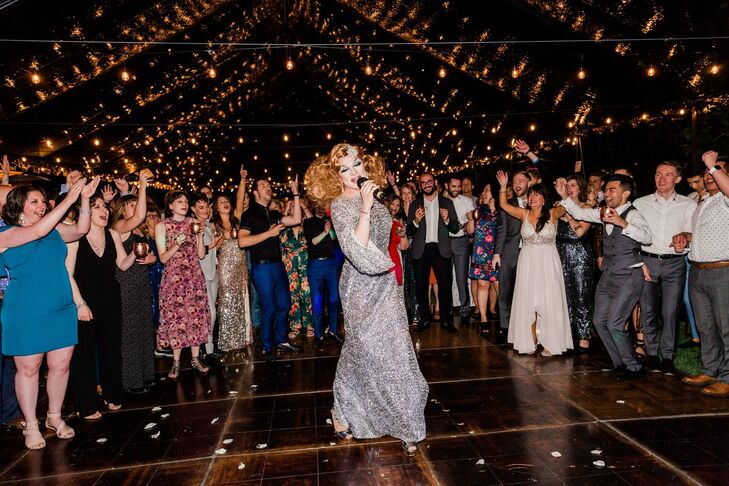 Modern Drag Queen Performer In Tent With String Lights