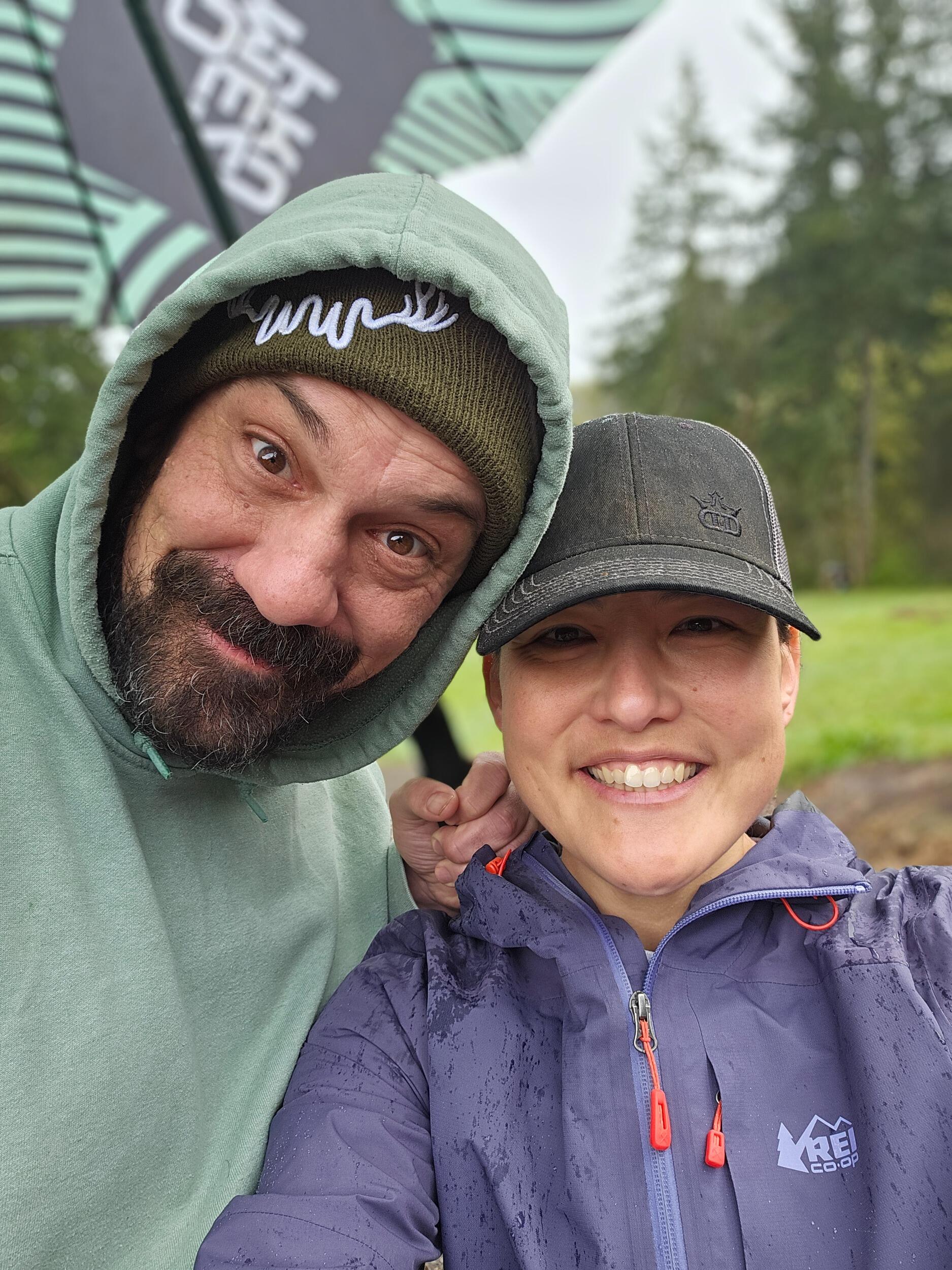 Not to be out-caddied, Martin is there to hold the umbrella for Ashley when she gets her first significant FPO win at a rainy Oregon Women's Series event at Horning's.
