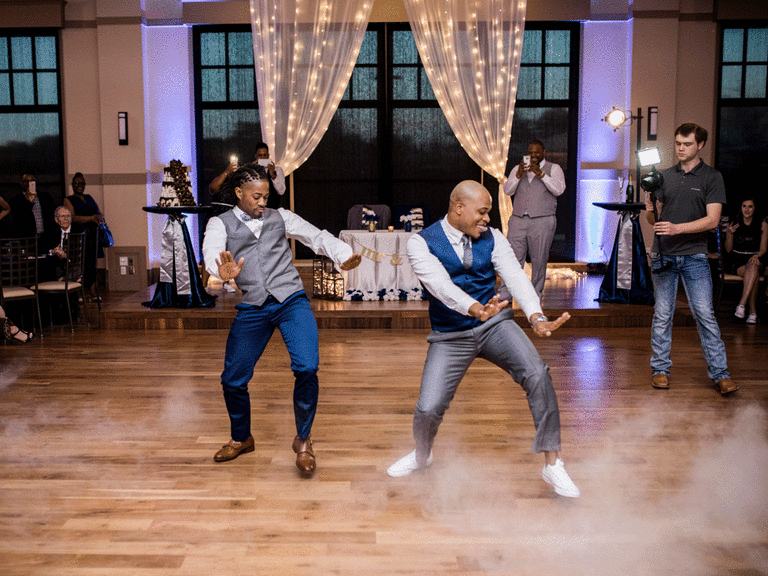Grooms doing choreography from wedding dance lessons.