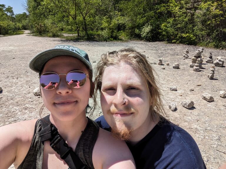 After 3 years of being long distance, they decided it was time to "tie the knot" and Nathan proposed at High Cliff State Park in June.