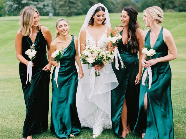 real wedding photo of mismatched emerald green jewel-tone bridesmaid dresses