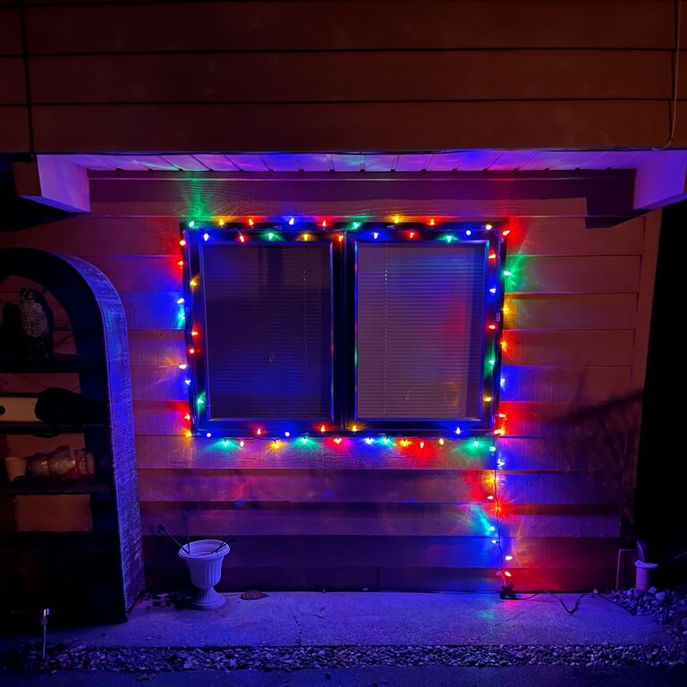 Our first (modest) attempt at displaying the holiday spirit our living room window.