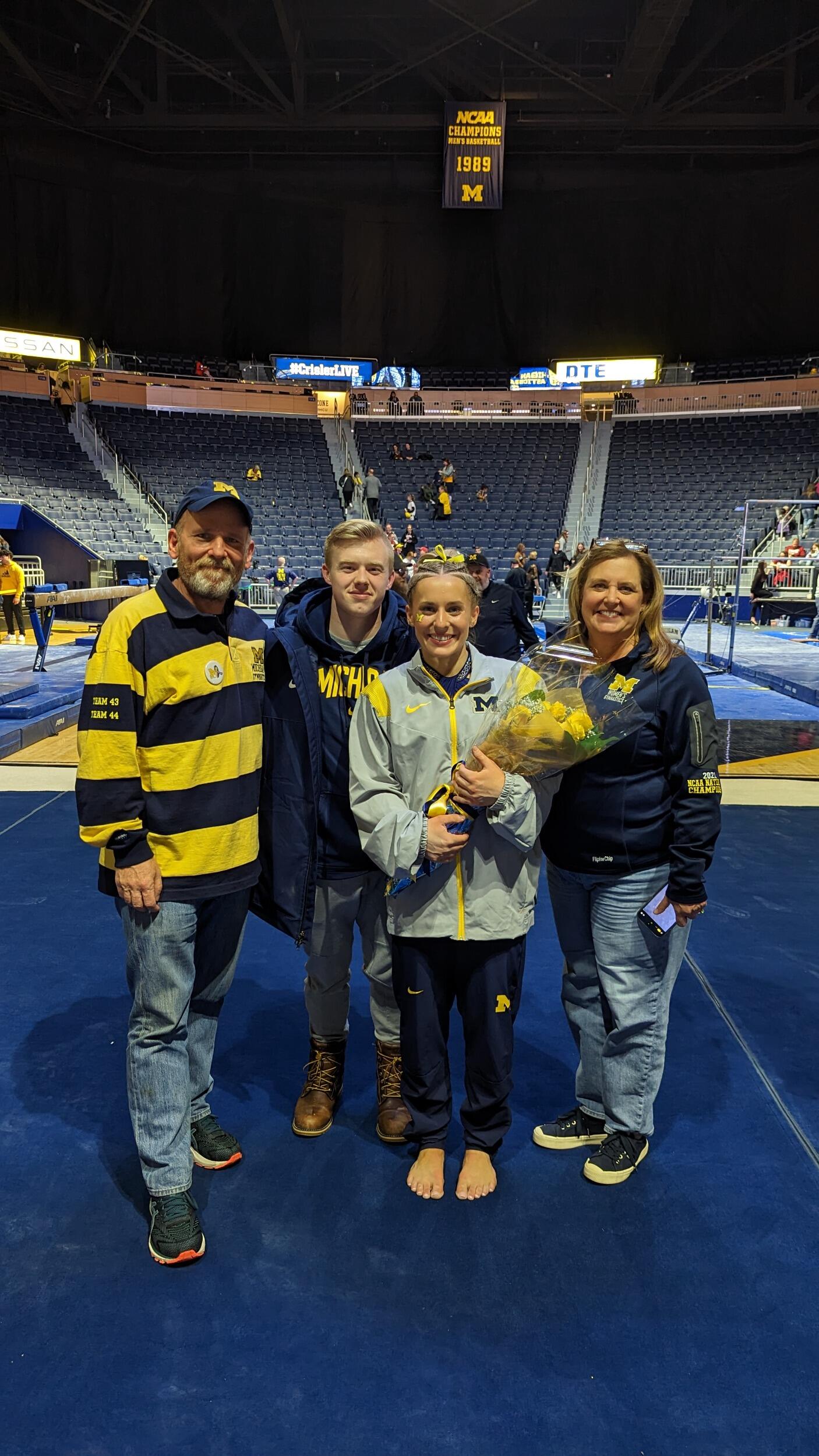 Supporting Abby at her last meet in Crisler Center.