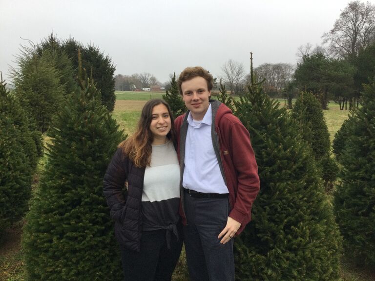 Ash helping pick out the Saar family Christmas tree.