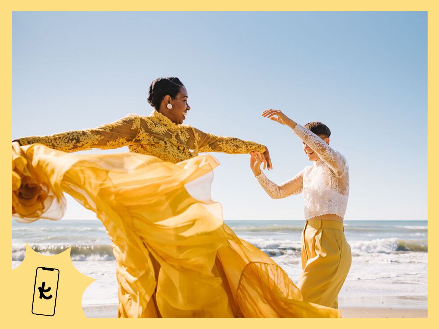 Couple wearing yellow and dancing on a beach