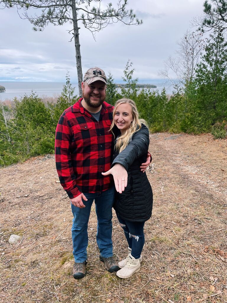 Jake's sister Julia and her boyfriend, Danny, were visiting Jake and Kayla in Door County for the weekend. They went for a hike at Peninsula State Park and after the hike, Jake got down on one knee and popped the big question! Kayla said yes, and they could not wait to start planning their future together!  THANKS @HINGE!!!