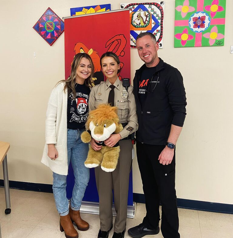 A great team for D.A.R.E graduation! Bride, Groom and maid of honor!
